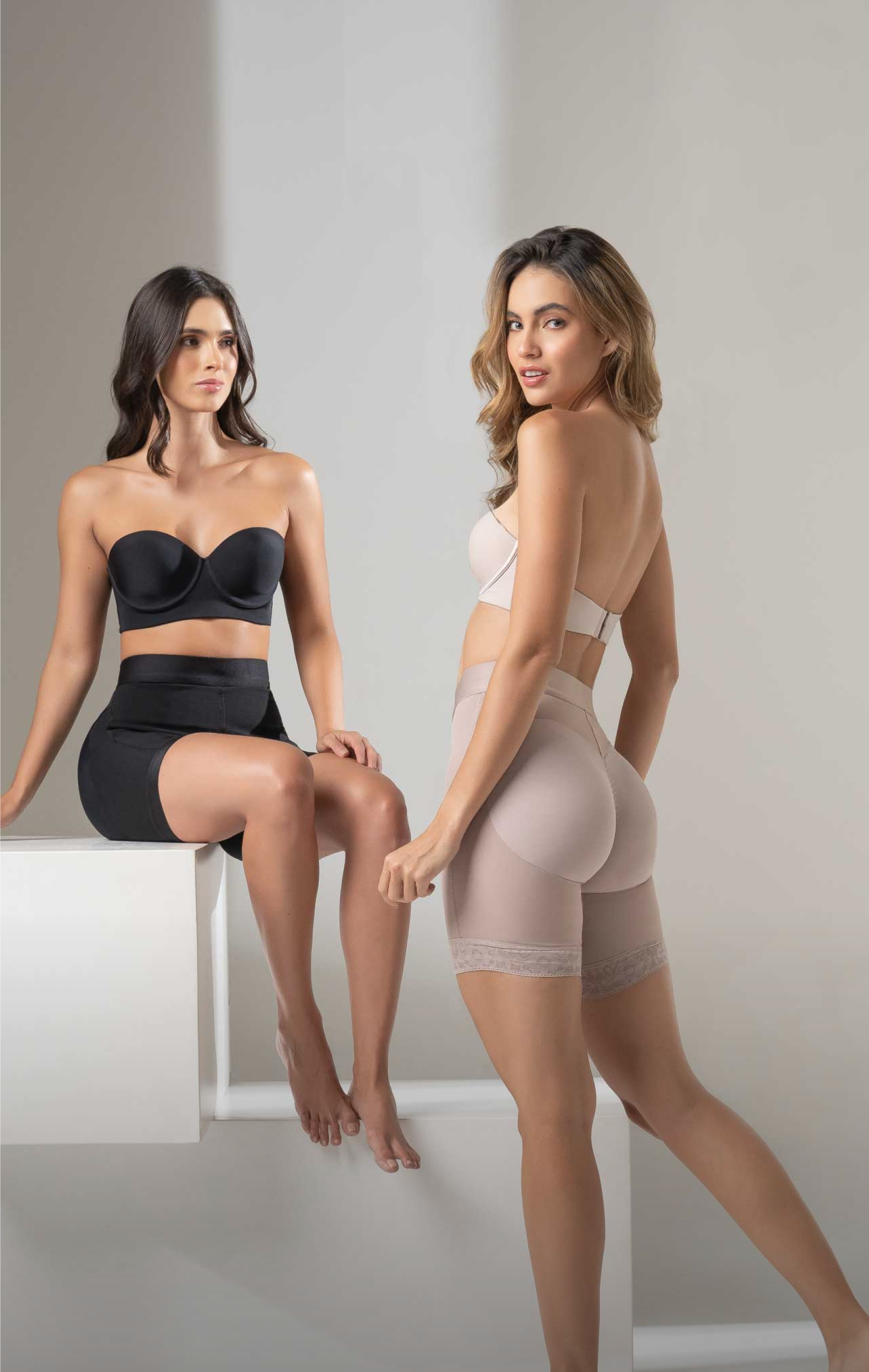 Two women wearing CYSM shaping shorts in black and nude, posing together with the message: Shaping is better together – One for you, one for your besties